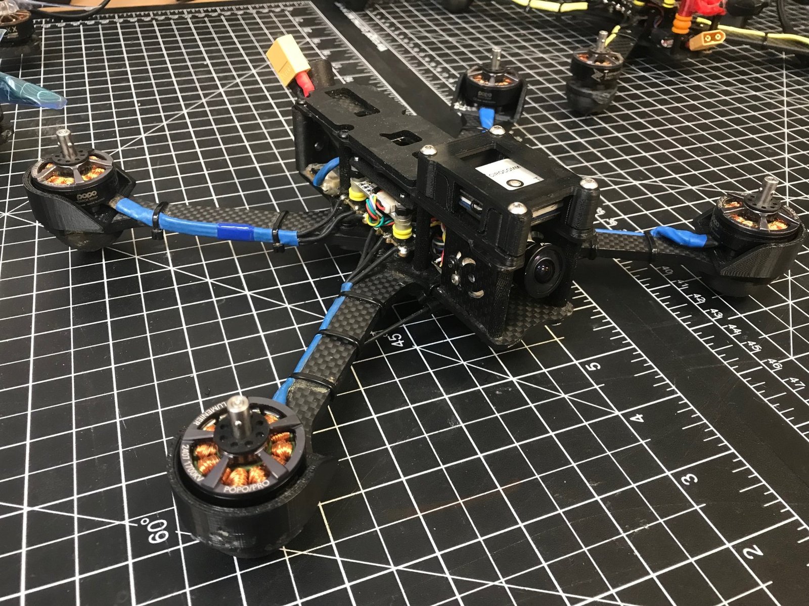 A five-inch FPV quad with 3D-printed motor guards and camera cage